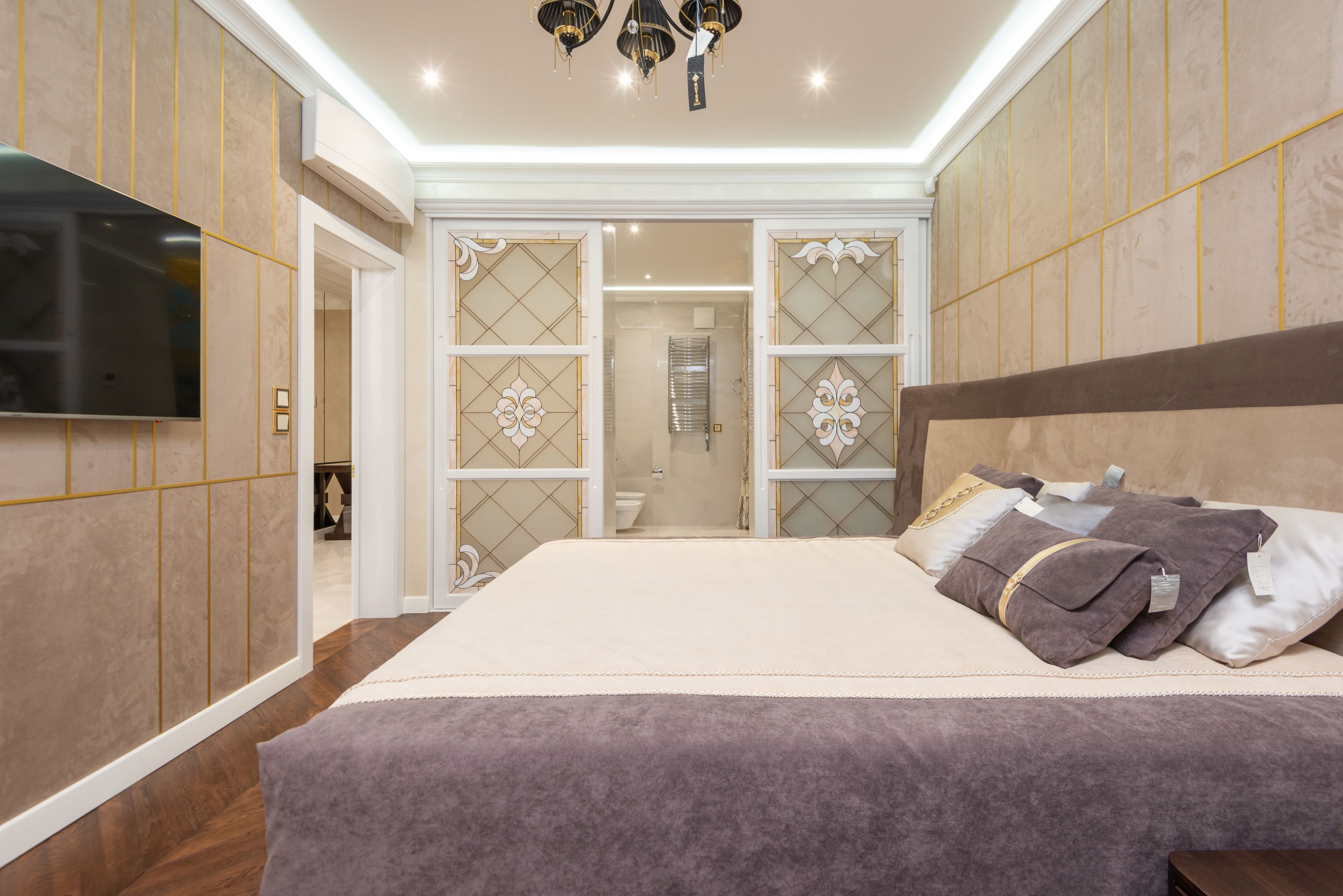 Sophisticated primary bedroom with soft natural light