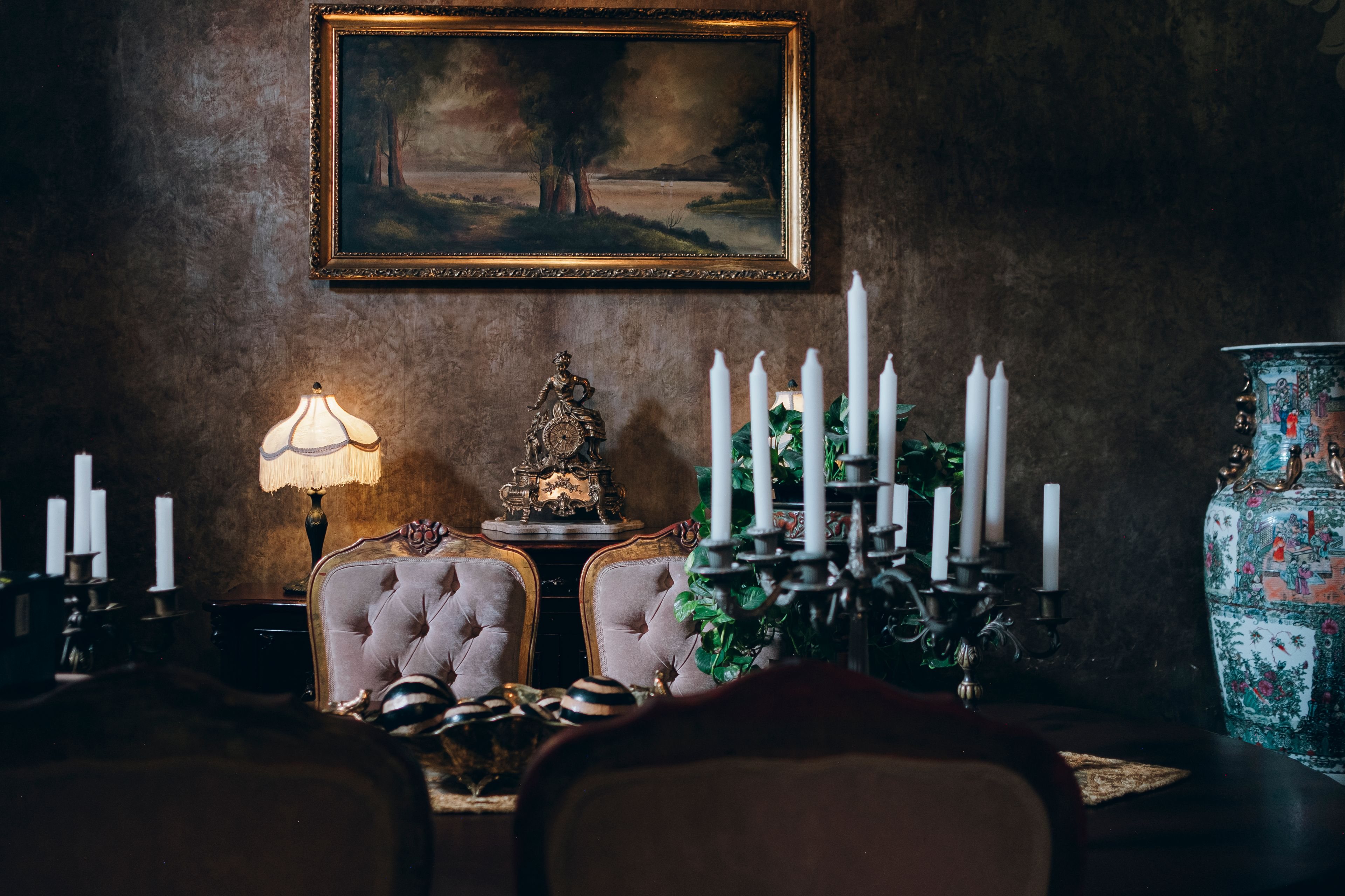 Formal dining room set under warm chandelier light