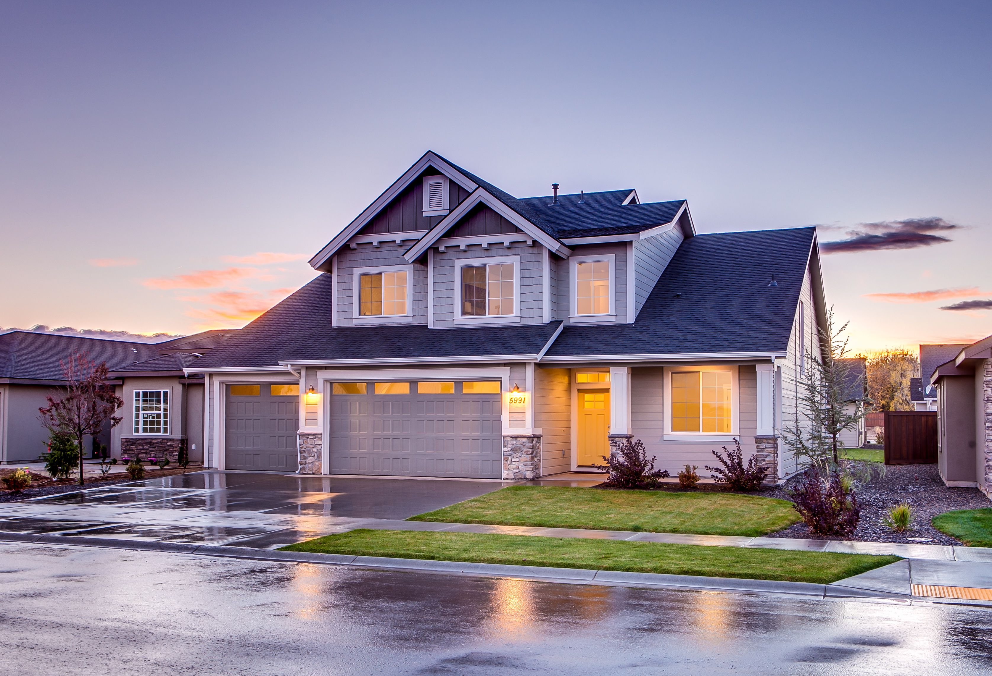 Suburban luxury home exterior at golden hour