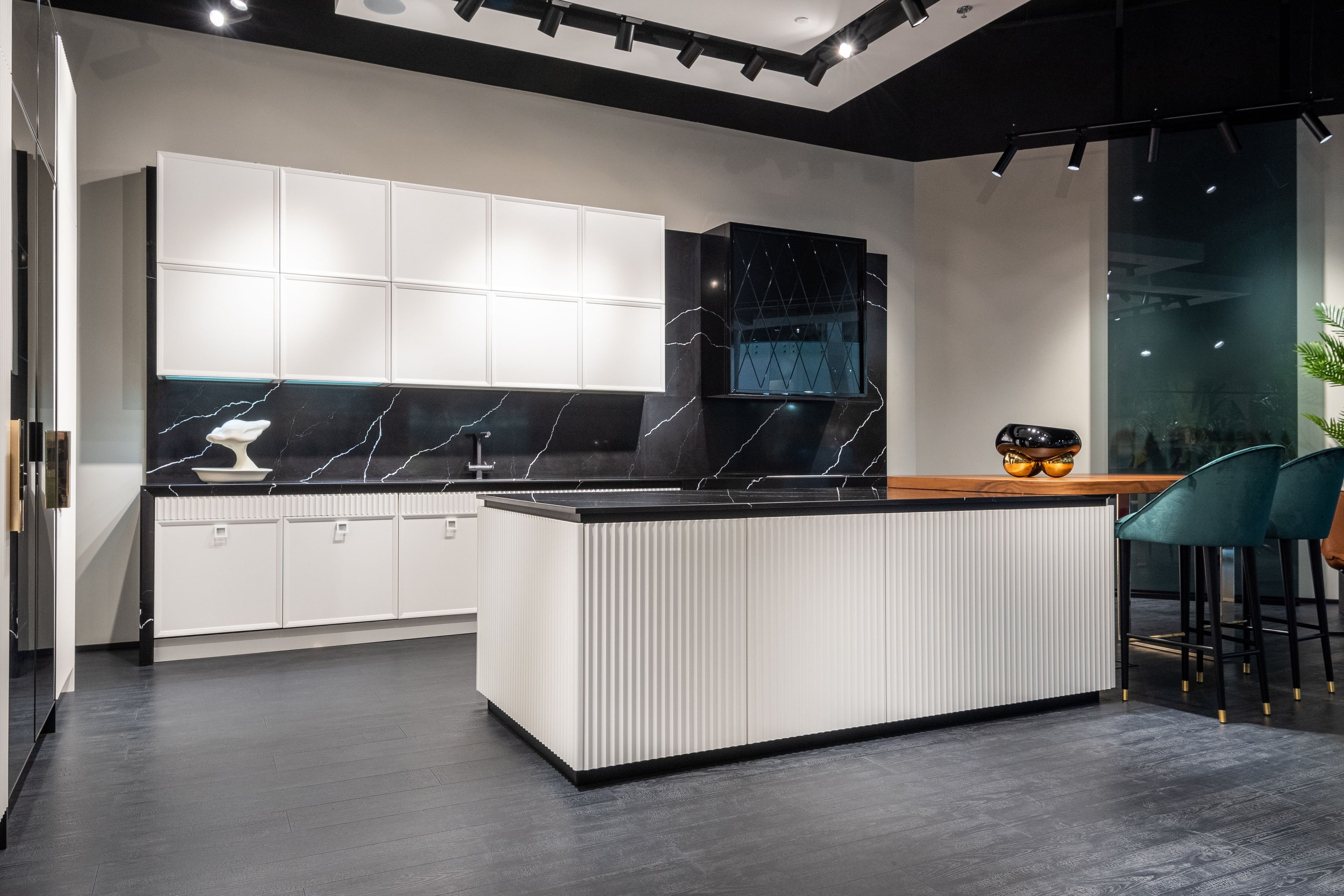Modern kitchen with white cabinetry and warm lighting